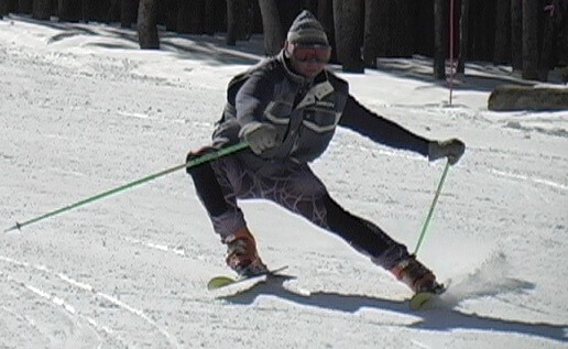 Skier in exagerated wide stance.