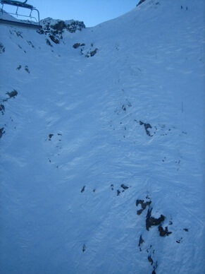 Photo showing a very steep slope and rocks