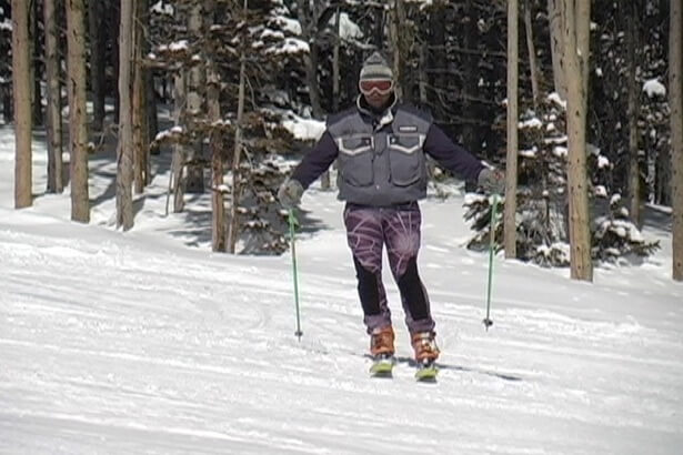 Skier standing naturally with feet beneath hips